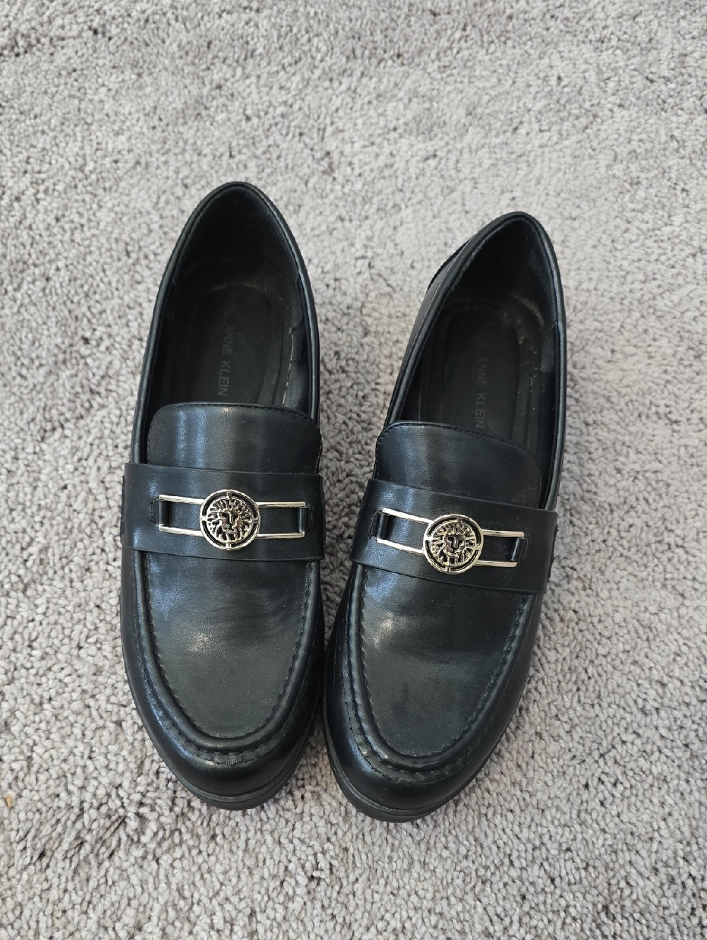Anne Klein Black Leather Slip-On Loafers with Silver Emblem